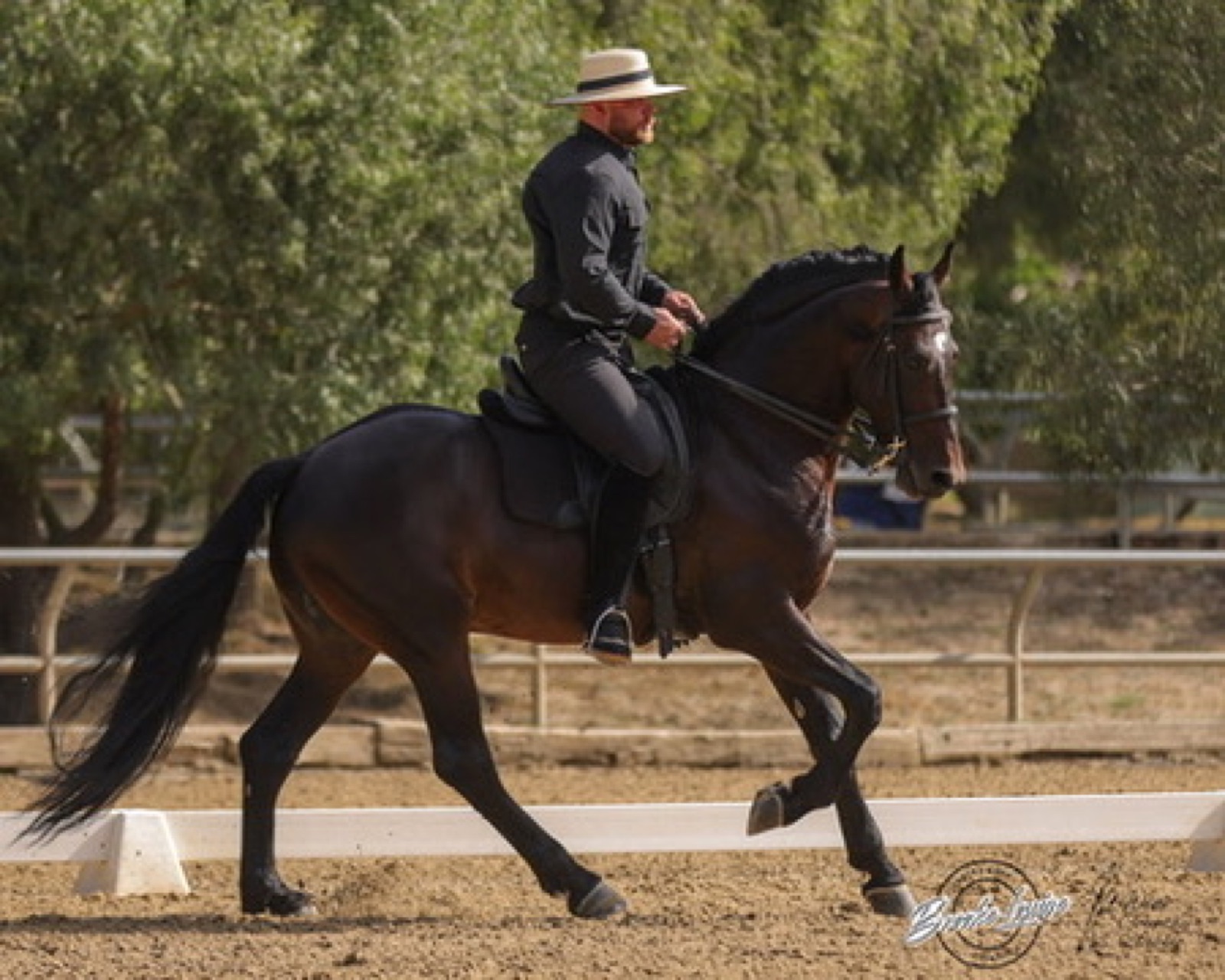 Hussar Stables instructor riding in the arena at Hansen Dam Horse Park